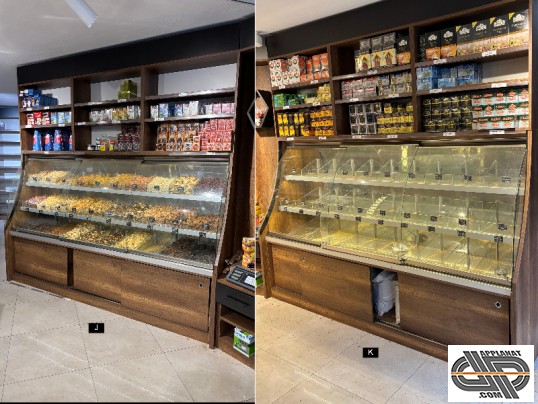 Vitrines éclairées à fond miroir avec des cases vitrées pour segmenter une proposition de fruits séchés et légumes secs exeposés en cascade.